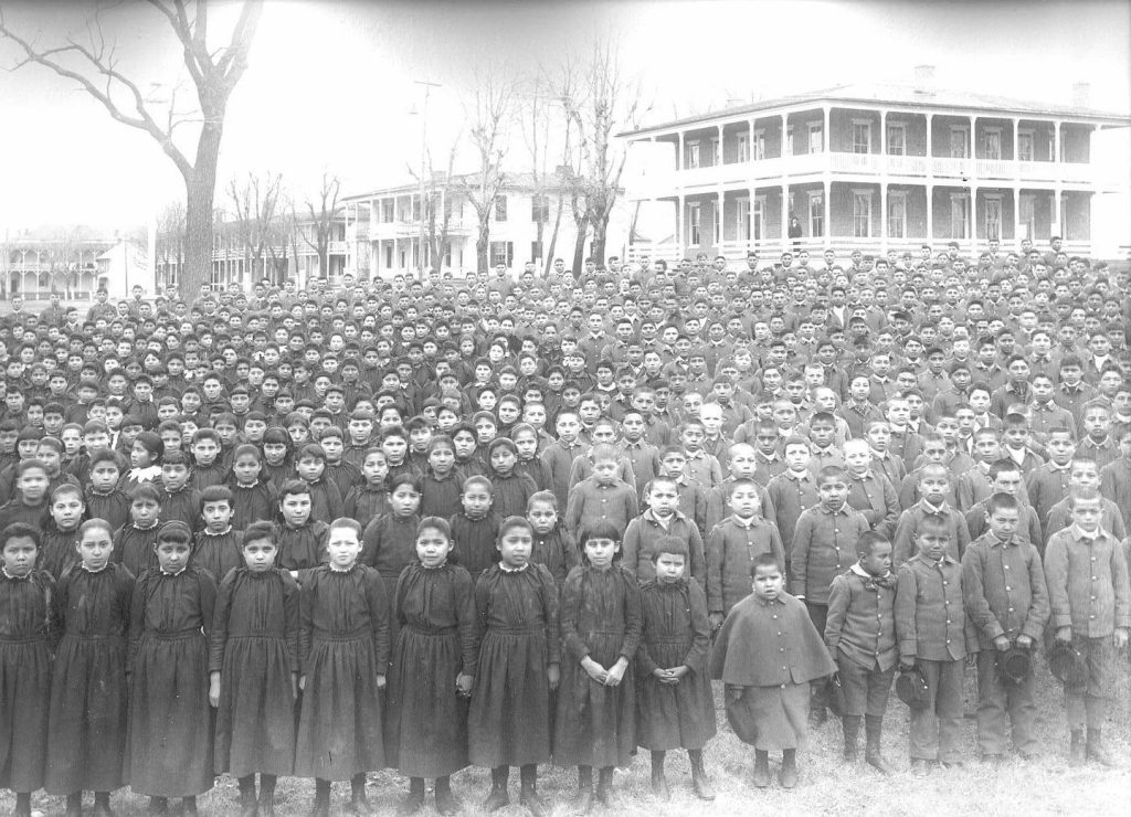 tudent body photograph on the grounds of the Carlisle Indian Industrial School